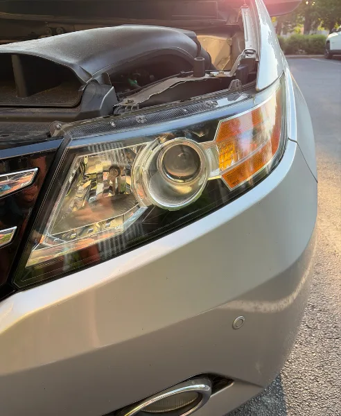 Silver minivan headlight, our own work, after restoration