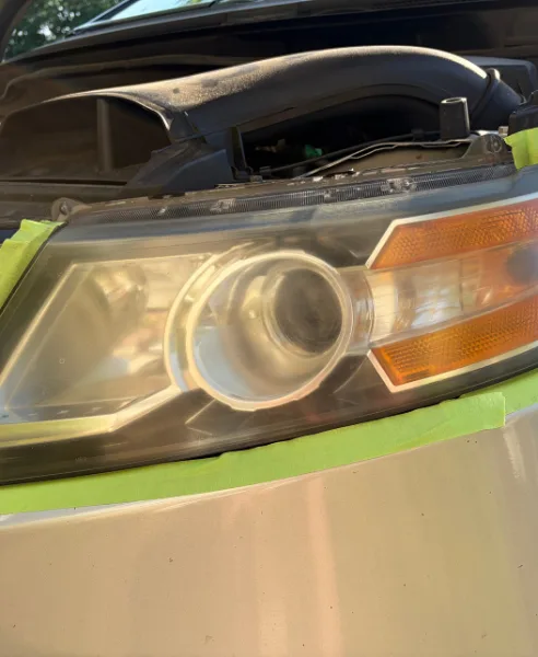 Silver minivan headlight, our own work, before restoration