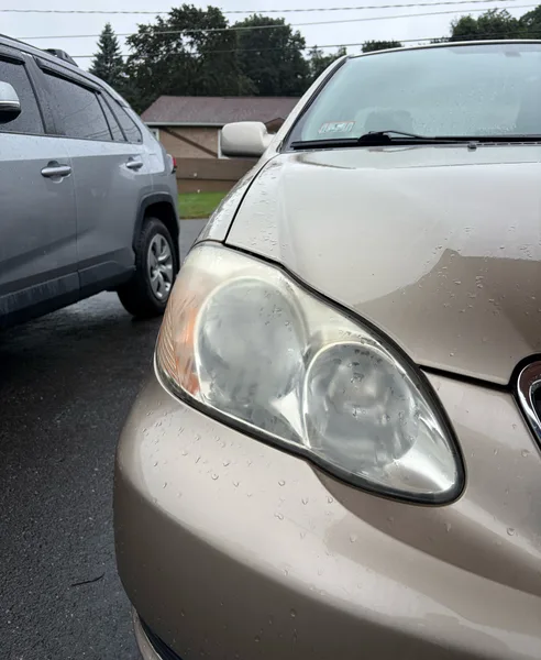 Toyota Corolla headlight in Fitchburg, Massachusetts, before restoration